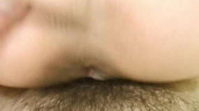 Japanese lady busy with her hairy pussy