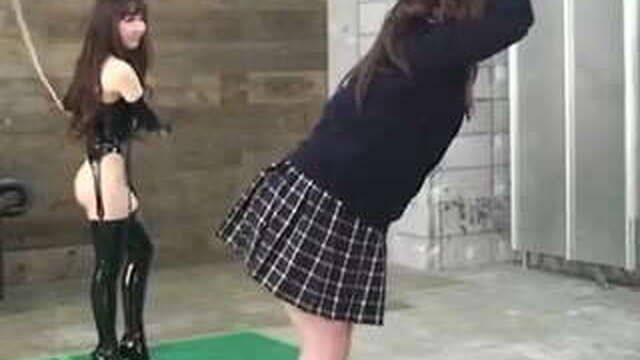 Hot Japanese mistress in latex teaches her bound slave