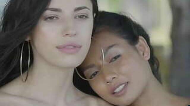 Miniature Asian and Russian young lesbians pose outdoors