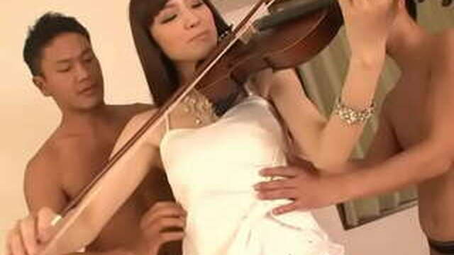 Pretty chick works double team while she plays the violin