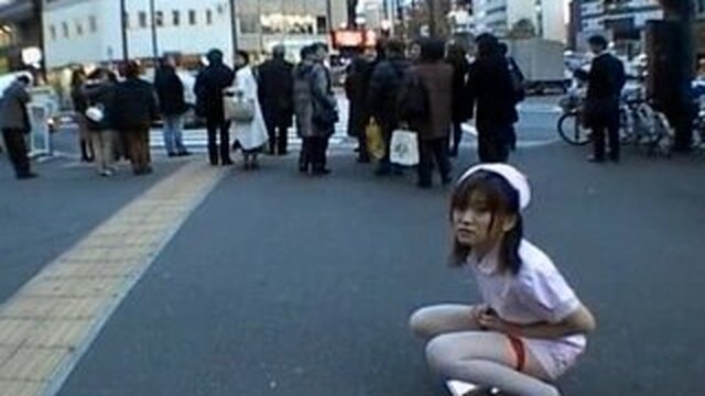 Naughty girl pees in public