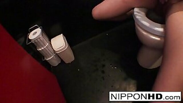 Japanese model enjoys solo playtime in a public restroom